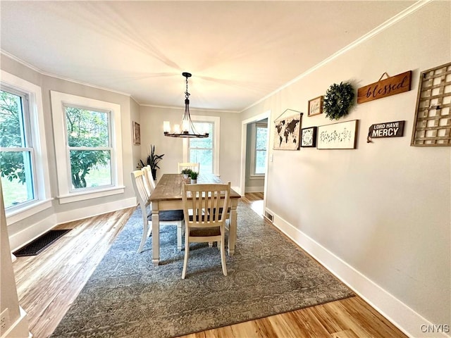 1058 State Route 48, Granby, NY 13069 - dining room featuring visible vents, ornamental molding, and wood finished floors