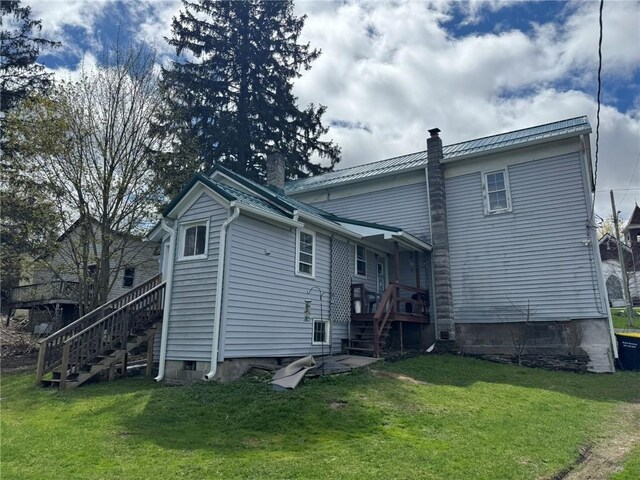2129 State Highway 206, Masonville, NY 13849 - back of property with stairs, a yard, and a chimney