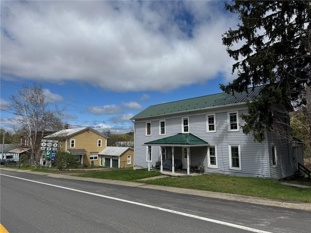2129 State Highway 206, Masonville, NY 13849 - view of front of property featuring a patio, a front lawn, and metal roof