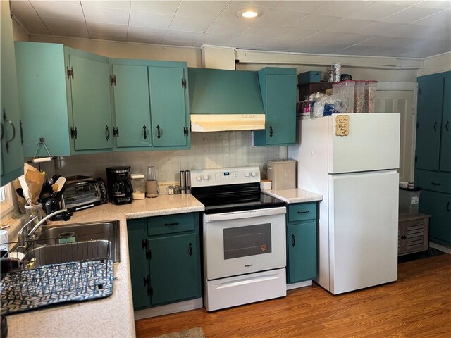 2129 State Highway 206, Masonville, NY 13849 - kitchen featuring white appliances, range hood, light wood-type flooring, light countertops, and a sink