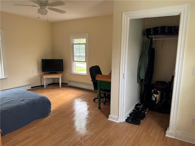 2129 State Highway 206, Masonville, NY 13849 - bedroom with a closet, a walk in closet, baseboard heating, and light wood-type flooring
