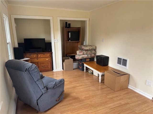 2129 State Highway 206, Masonville, NY 13849 - living room featuring baseboards, visible vents, ornamental molding, and light wood-style flooring