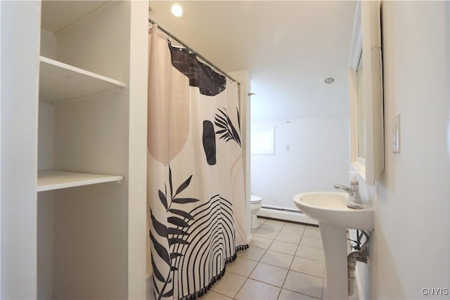 bathroom with tile patterned flooring, baseboard heating, toilet, and a shower with shower curtain