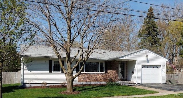 134 Elm St, Watertown-City, NY 13601 - single story home featuring an attached garage, a front lawn, fence, and driveway