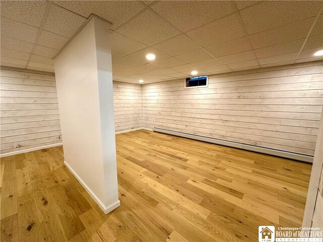 3542 Morgan Hollow Rd, Allegany, NY 14706 - finished below grade area with wooden walls, a paneled ceiling, recessed lighting, baseboards, and wood finished floors