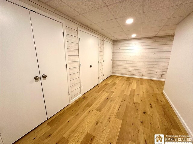 3542 Morgan Hollow Rd, Allegany, NY 14706 - interior space with wooden walls, light wood-style floors, a paneled ceiling, recessed lighting, and baseboards