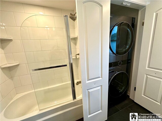 3542 Morgan Hollow Rd, Allegany, NY 14706 - bathroom with tile patterned floors, combined bath / shower with glass door, and stacked washer and clothes dryer