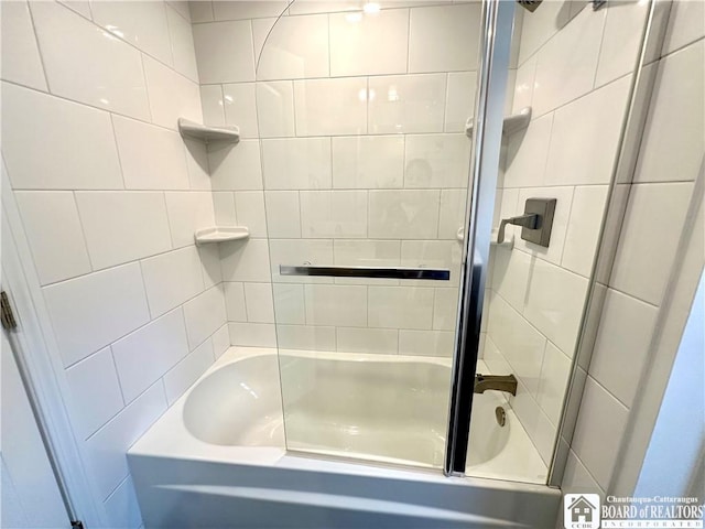 full bathroom featuring bath / shower combo with glass door