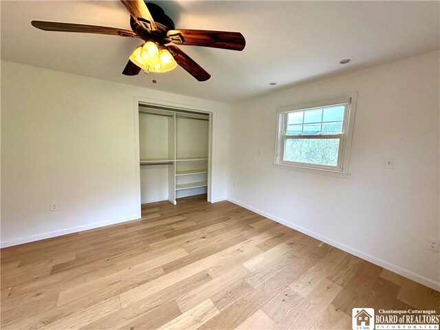 3542 Morgan Hollow Rd, Allegany, NY 14706 - unfurnished bedroom featuring light wood-type flooring, a ceiling fan, baseboards, and a closet
