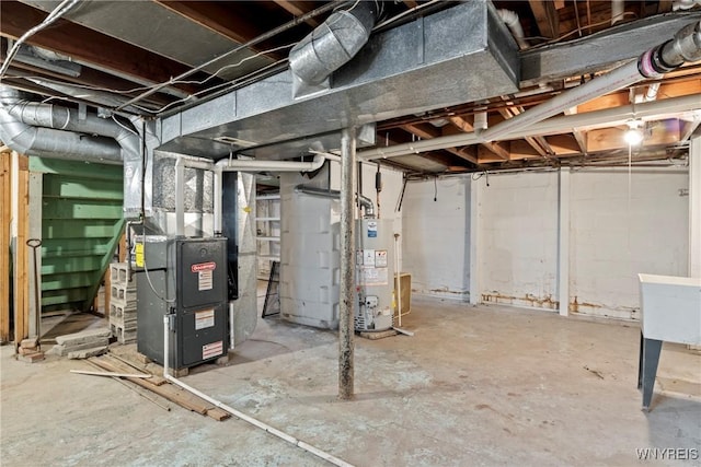 unfinished basement featuring heating unit and water heater