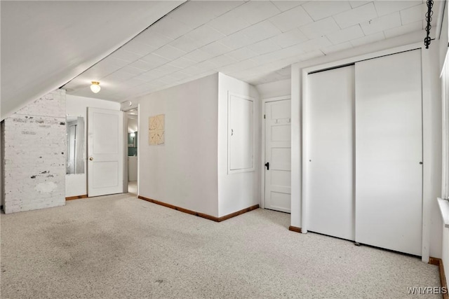 additional living space with carpet floors and baseboards
