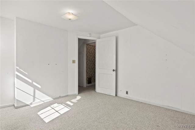 additional living space with baseboards, carpet, and visible vents