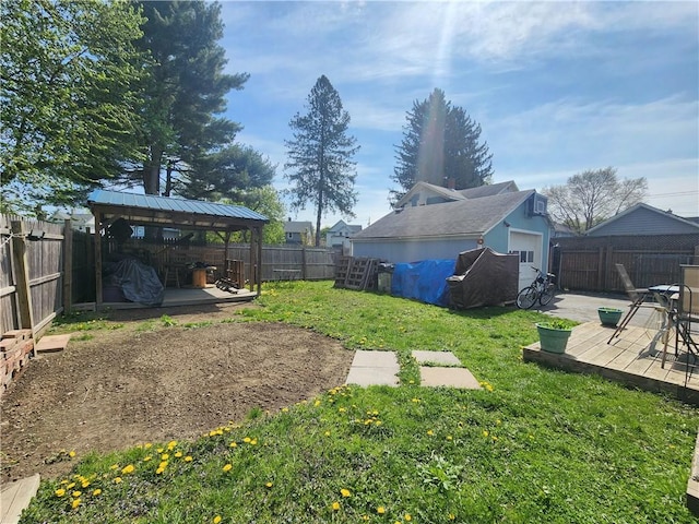 view of yard with a gazebo, a fenced backyard, and a wooden deck