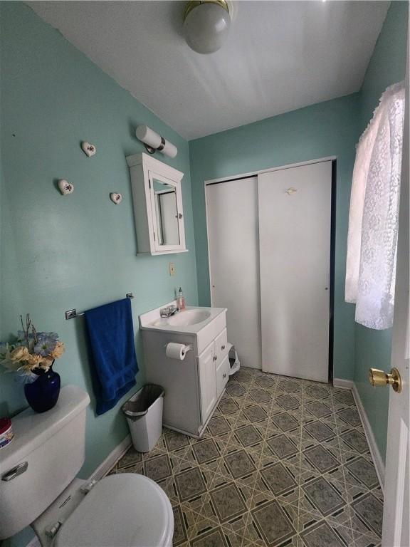 bathroom featuring vanity and toilet