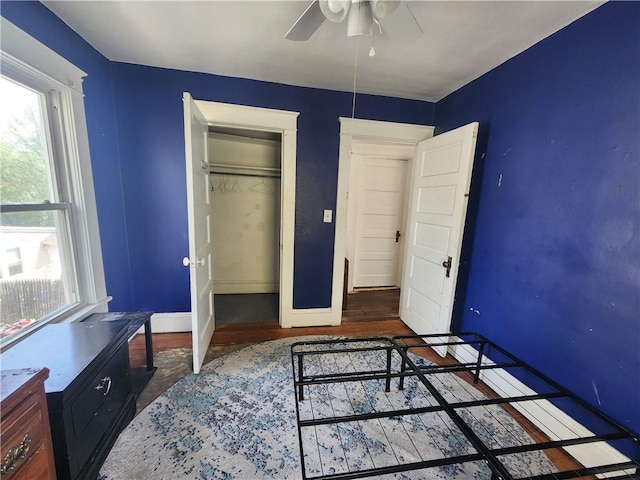bedroom with baseboards and wood finished floors
