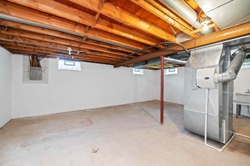basement featuring electric panel