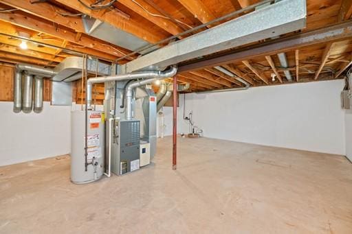 unfinished basement featuring gas water heater
