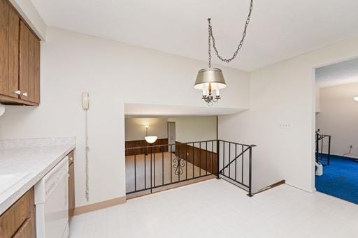 interior space featuring an upstairs landing and light floors