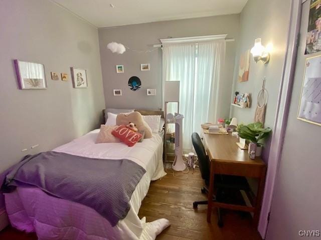 bedroom featuring wood finished floors