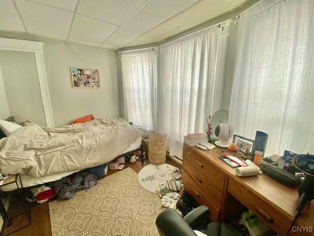 bedroom featuring a paneled ceiling