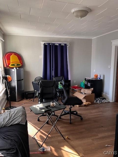 interior space featuring ornamental molding and wood finished floors