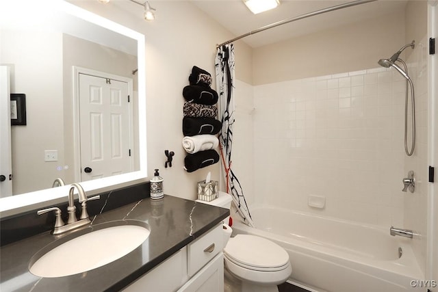 full bathroom with vanity, toilet, and shower / tub combo