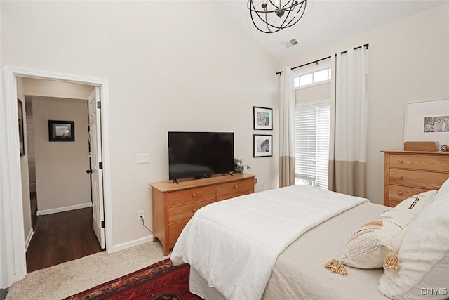 bedroom featuring visible vents, carpet flooring, baseboards, and high vaulted ceiling