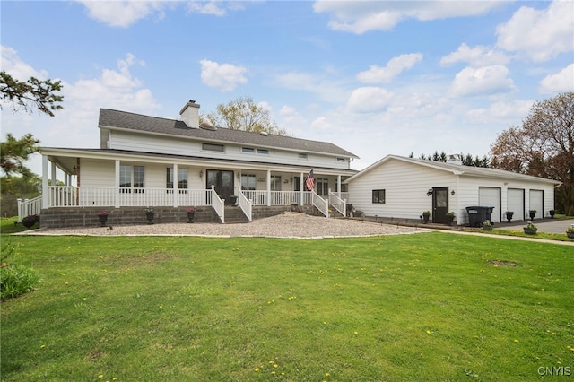 rear view of property with a porch, a yard, a chimney, and a garage