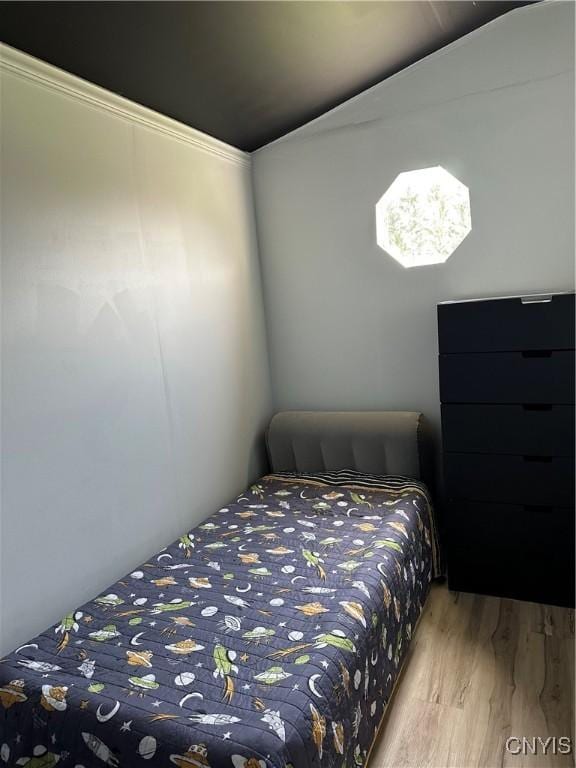 bedroom with wood finished floors