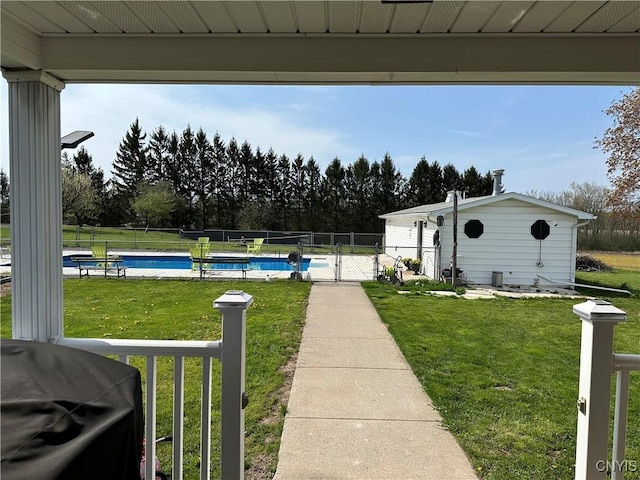 view of yard featuring a fenced in pool and fence