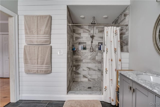 full bath with vanity and a stall shower