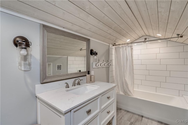 bathroom with wood ceiling, wood finished floors, vanity, lofted ceiling, and shower / bathtub combination with curtain