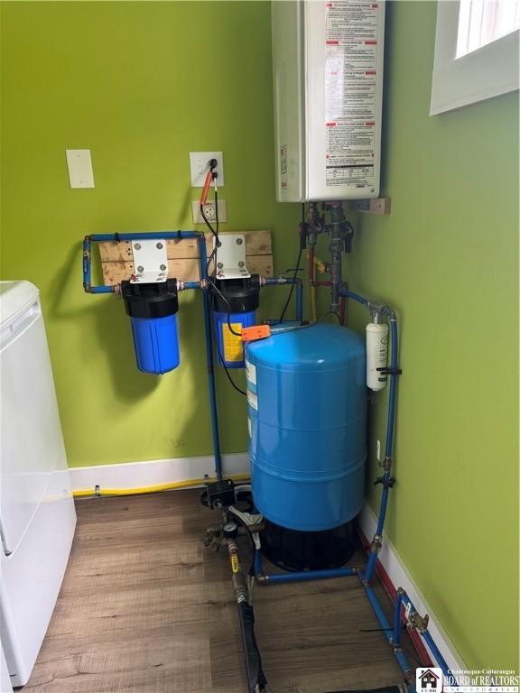 utilities featuring independent washer and dryer and water heater