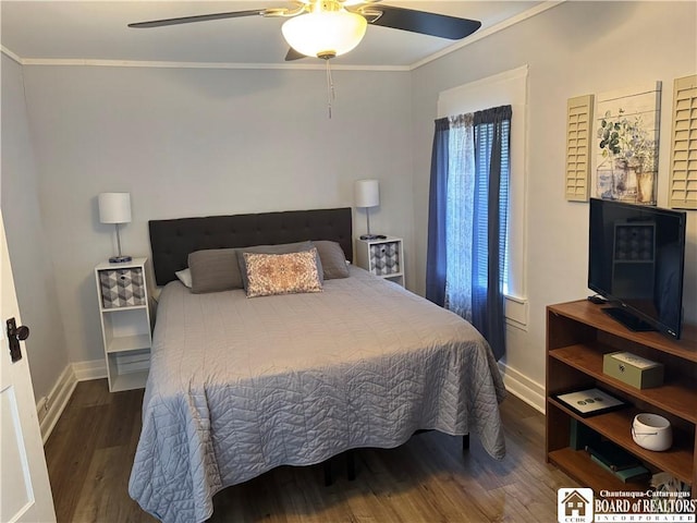 bedroom featuring crown molding, baseboards, ceiling fan, and wood finished floors