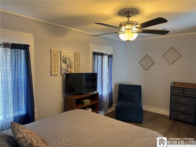 bedroom featuring crown molding, dark wood-style flooring, ceiling fan, baseboards, and visible vents