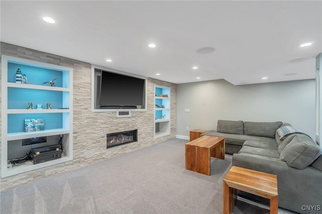 carpeted living room featuring recessed lighting, built in features, baseboards, and a fireplace