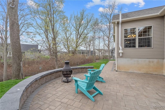 view of patio / terrace featuring an outdoor fire pit