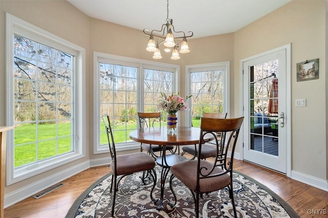 dining room with visible vents, baseboards, and plenty of natural light