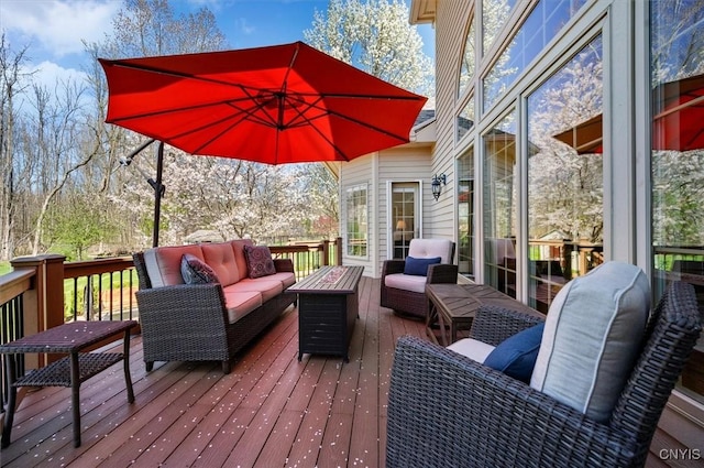 wooden deck featuring an outdoor hangout area