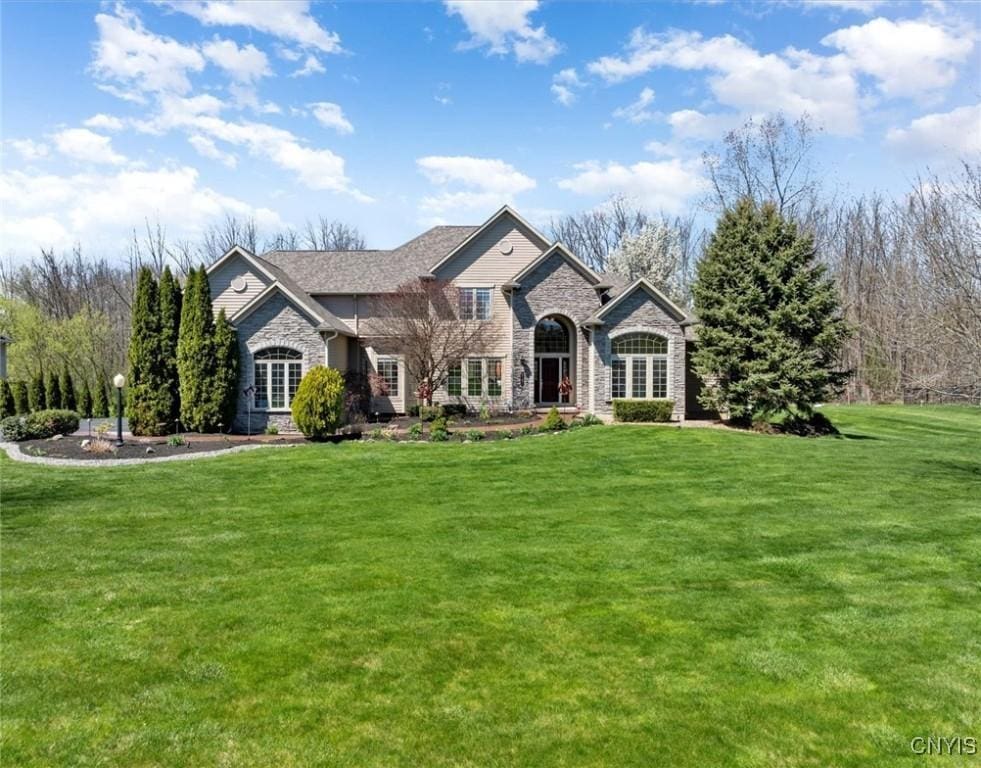 8181 Cranes Watch Cir, Lysander, NY 13027 - view of front facade with stone siding and a front yard