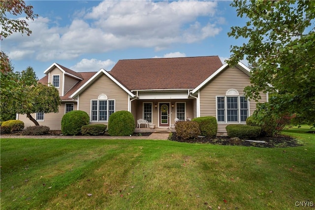 view of front of house featuring covered porch and a front lawn