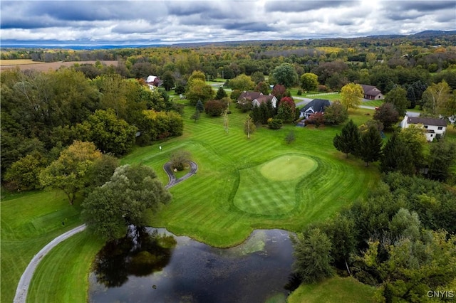 drone / aerial view featuring view of golf course and a water view