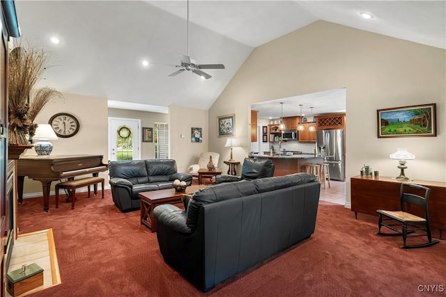 living area featuring recessed lighting, carpet floors, ceiling fan, and high vaulted ceiling