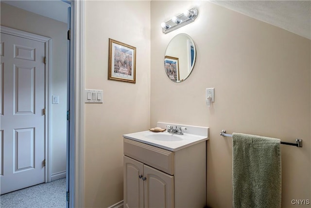 bathroom with baseboards and vanity