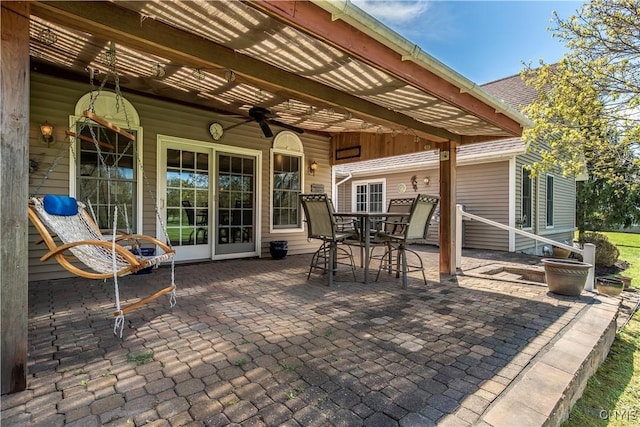 view of patio / terrace featuring a ceiling fan and outdoor dining space