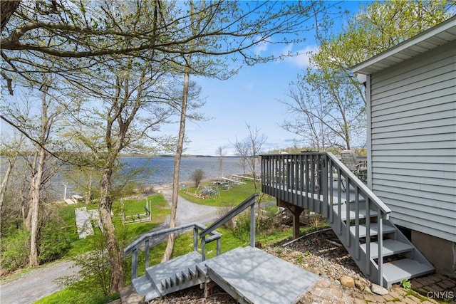 wooden terrace with a water view