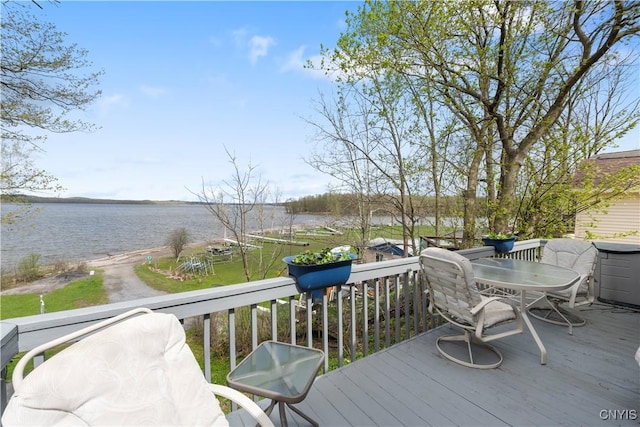 wooden terrace with a water view