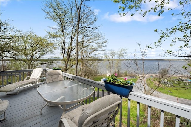 wooden terrace featuring a water view