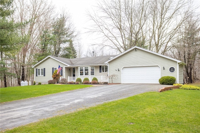 ranch-style house with a garage, aphalt driveway, covered porch, and a front yard