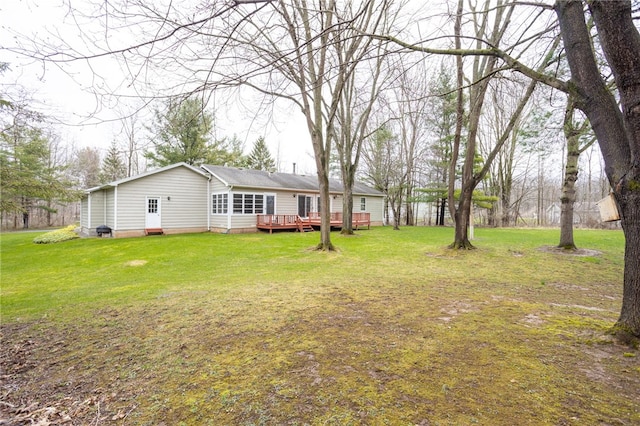 view of yard with a deck